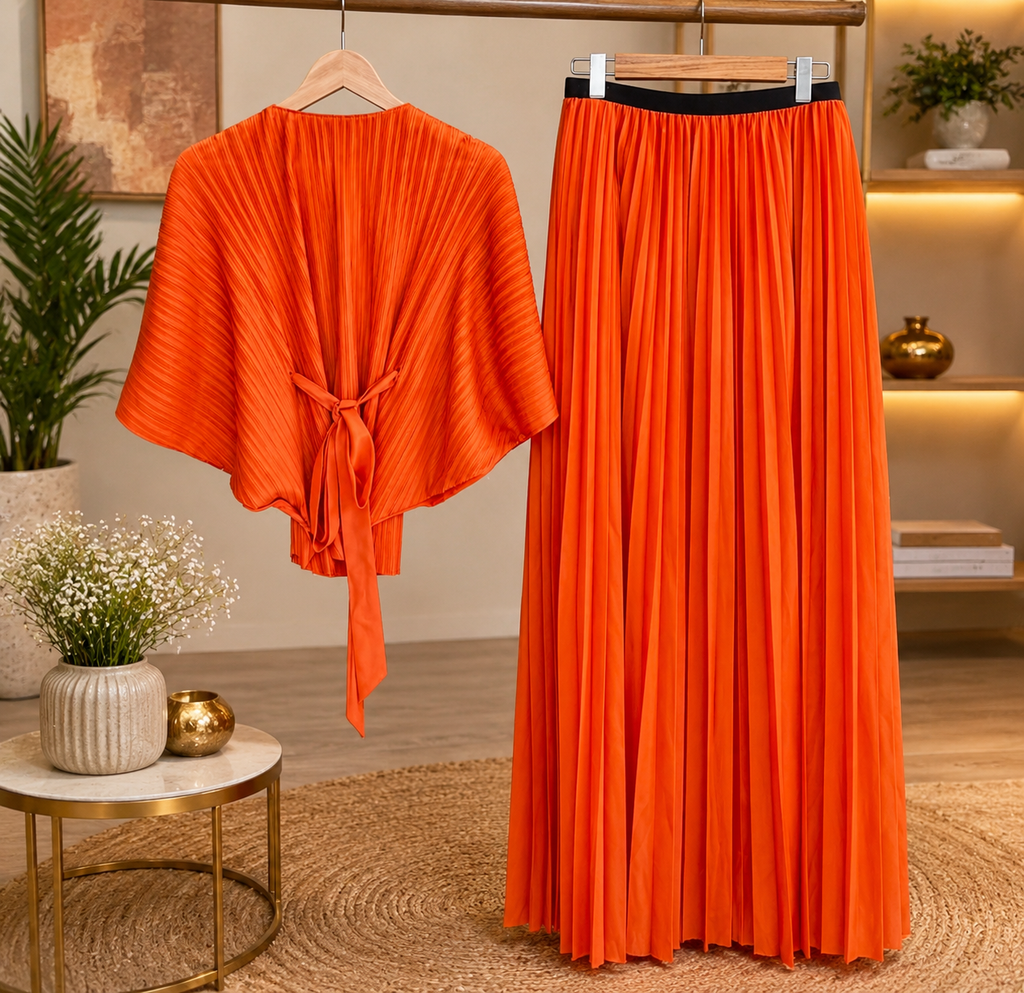 Elegant Orange Pleated Maxi Dress with Floral Waist Detailing