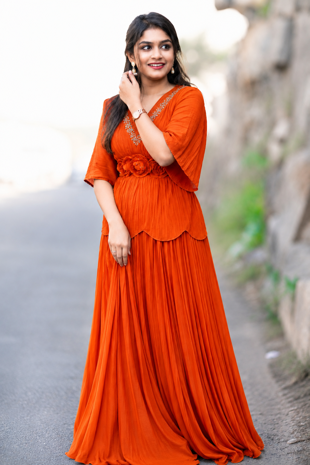 Elegant Orange Pleated Maxi Dress with Floral Waist Detailing